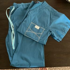 Blue sky scrubs- size M, too and bottom. Shelby top and bottom.